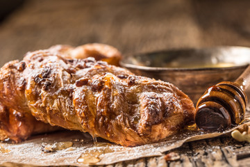Sweet Pastry. Sweet pie honey cup of coffee on wooden table. Sweet breakfast
