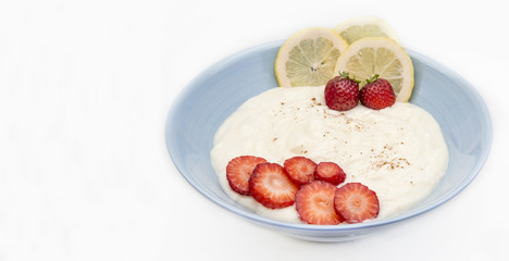 Lemon cream with strawberries.