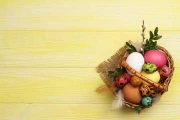 Multicolored easter eggs in a basket