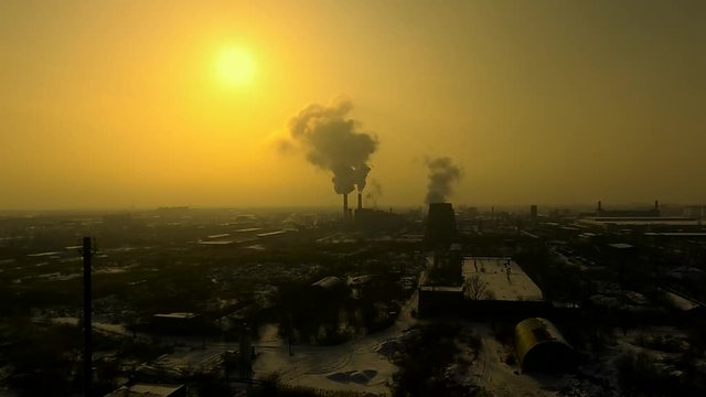 Industrial area, smoke at dawn