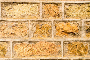 Brown stone wall background with gray seal