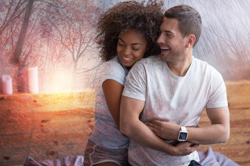 Perfect couple. Joyful sweet pleasant couple smiling and enjoying their time together while being in love