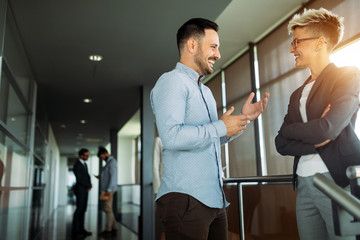 Picture of business colleagues talking in office