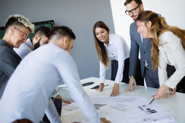 Team of architects working on construction plans