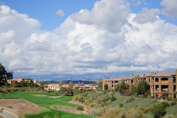 golf field with clouds in sunny day