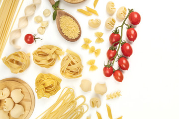 Overhead photo of different types of pasta with cherry tomatoes on white with copy space