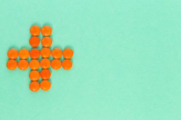 Red cross made of pills or tablets