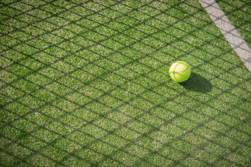 Paddle tennis court and net with a ball