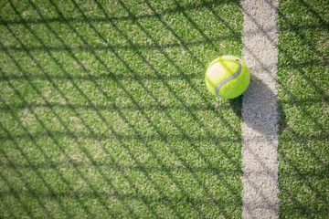 Paddle tennis court and net with a ball