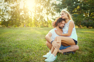 Fototapeta premium A middle-aged couple together in nature. Portrait of husband and wife in the park.