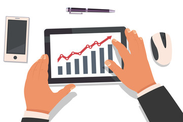 Businessman hands holding a tablet and working with a graph of market analysis statistics. Top view vector flat illustration of a workplace with gadgets.