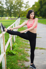 Girl doing gymnastic exercises or exercising outdoor