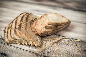 Fresh sliced bread on wooden table