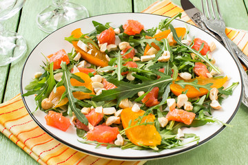 Fresh salad with salmon and persimmon