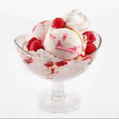 Ice cream dessert with raspberries in glass cup