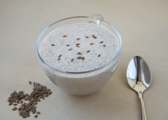 Glass of classik greek yoghurt with crushed flax seeds