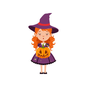 Young red-haired girl witch standing with pumpkin face in her hands and wearing purple dress and hat. Kid character in Halloween costume. Vector flat cartoon