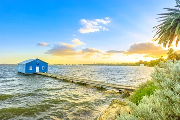 Fototapeten Blue Boat House: the iconic and most photographed Perth landmark in Western Australia. Scenic sunset landscape on the Swan River. Boathause with wooden jetty and copy space. © bennymarty