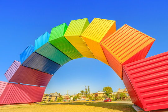 Fremantle travel welcome. Rainbow sea container in Fremantle Port near Perth, Western Australia. Homosexuality and universal symbol of hope concept. Sunny day with blue sky. Copy space.