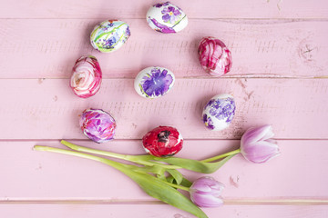 Pink Easter Eggs and Tulips Flowers on a Pink Wooden Background. Easter Decoration. Decoupage ideas .