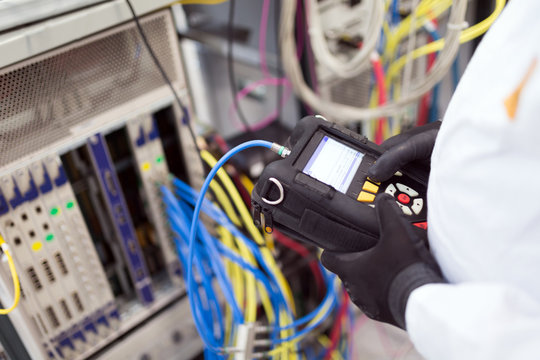 Picture of technician repairing cmts networking cards