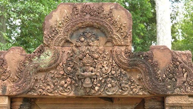 carving of narashima clawing hiranyakasipu on a pediment at banteay srei, angkor, cambodia
