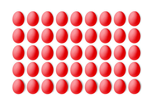Set of red eggs on a white background, laid in a line. 