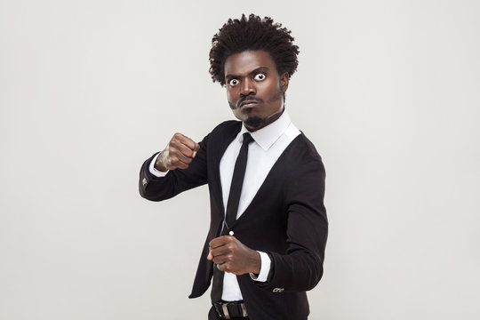 Aggressive concept. Furious businessman ready to fight.