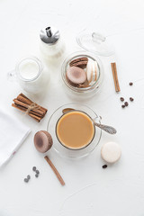 Breakfast with coffee and milk, some sweet french cookies. Morning time. Top view, flat lay.