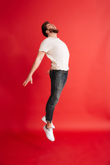 Excited bearded man levitate isolated