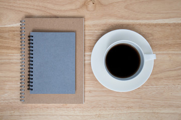 coffee and book on wood table