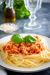 Spaghetti with meat ragout, tomato sauce and cheese, selective focus