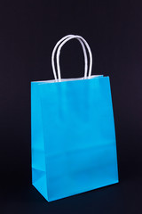 blue shopping bag on white-black background