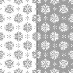 White and gray floral backgrounds. Set of seamless patterns