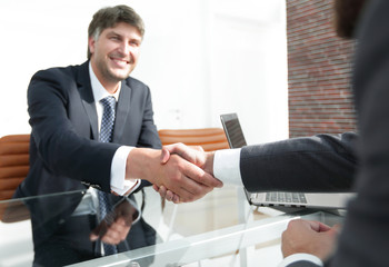 businessman stretches out his hand for a handshake