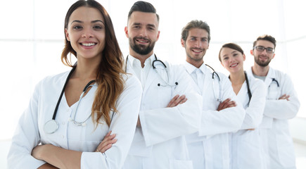 Fototapeta premium Portrait of medical team standing with arms crossed in hospital