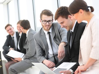 employee with colleagues before the briefing