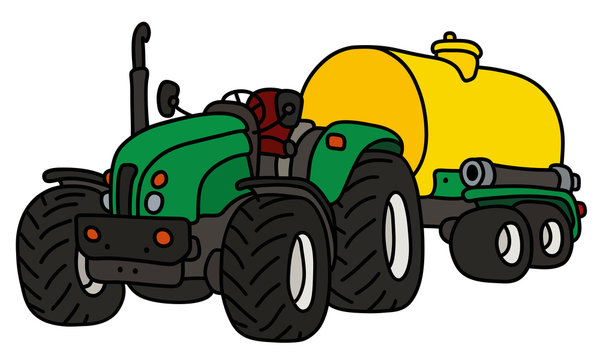 The green open heavy tractor with a yellow tank trailer