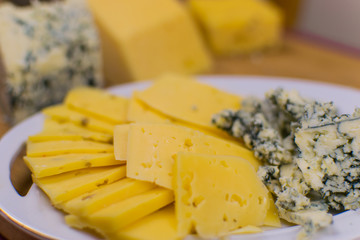Different kinds of cheese chopped.