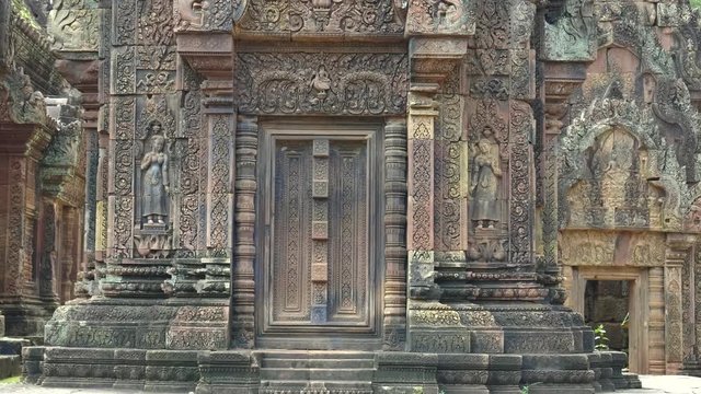 pan of two stone devata at banteay srei temple in the angkor region of cambodia