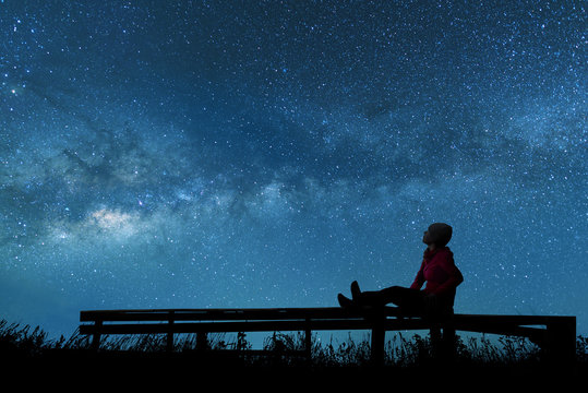 Girl watching the stars in night sky