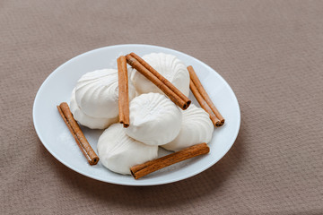 white marshmallow and cinnamon on a plate