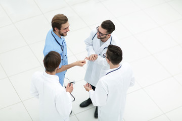 smiling group of doctors discussing