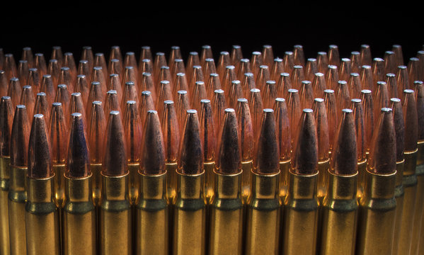 Large amount of rifle bullets on a black background