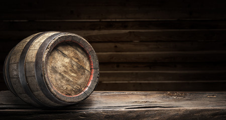 Wine barrel on the old wooden table.