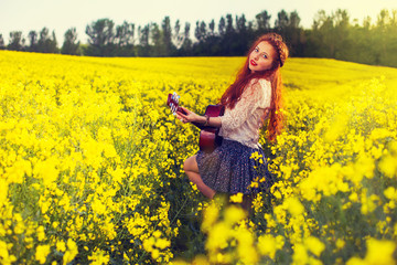 Fototapeta premium Young ginger hair girl in 70s style with acoustic guitar