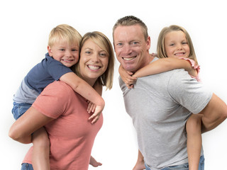 Obraz premium happy and beautiful American family with husband and wife carrying on their back little son and lovely young daughter in love parents and children