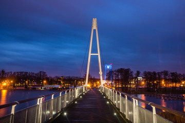 Pier at the Niegocin lake and rainy clouds at night in Gizycko, Masuria, Poland