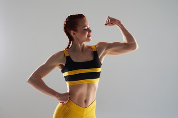 strong woman showing biceps