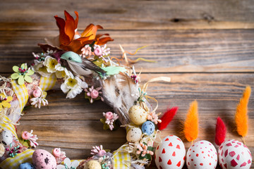 Easter wreath with eggs on a wooden background, concept of holidays